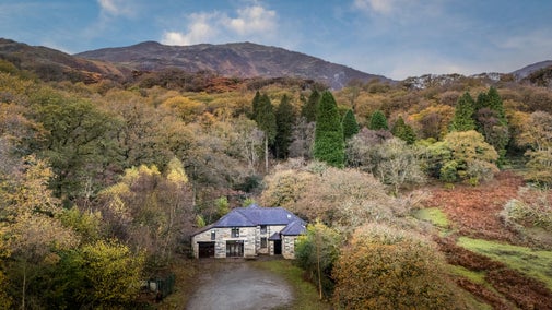 An aerial view of Watkin Bunkhouse, with mountains in the background, Gwynedd